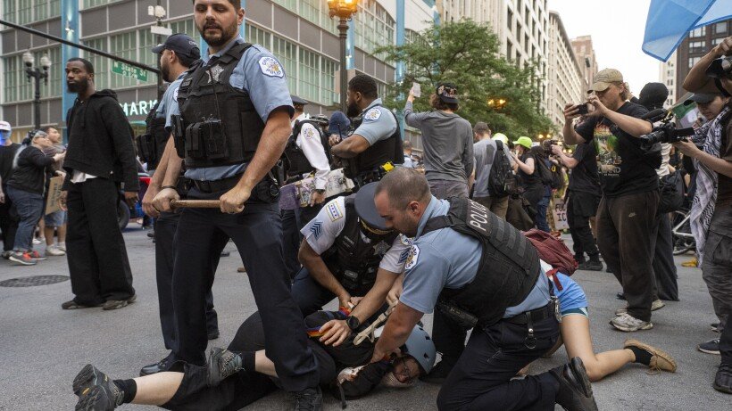 Counter-Protester Removed During Pro-Immigration Rally at Daley Plaza