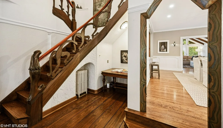 Winnetka, IL (June 8, 2025) — A storybook-style cottage tucked away in Chicago’s North Shore suburb of Winnetka is turning heads for its charming, fantasy-like architecture and intricate design features. The home, listed for $829,000, is currently in contingent status, but its magical appeal continues to attract attention across the region.

A Fantasy Feel in the Heart of the North Shore
Located at 1487 Tower Road, this 1933-built home feels like something out of a fairy tale — complete with arched, painted doorways, a carved wood double staircase, and a Juliet balcony that brings to mind classic European romance.

Inside, a library with ladder access and loft space adds to the whimsical aesthetic, inviting imagination and quiet reading time in a space built for daydreaming.

Modern Comforts in a Timeless Package
While the architecture screams fantasy, the home itself is packed with modern updates following a major renovation in 2010. Among its amenities:

Brand-new appliances

High-efficiency boiler

Heated two-car garage

Its design merges the best of historical charm and modern living, ideal for buyers looking for a home that feels unique without sacrificing functionality.

Convenient Location With Scenic Access
Beyond the home’s design, its location offers access to:

Metra trains for commuter ease

Interstate 94 for regional travel

Lake Michigan’s shoreline for recreation

This combination of aesthetic charm, practical renovations, and prime location makes the home a standout in Chicago’s North Shore housing market.

Listing Details & Photography Credits
The listing and accompanying photographs are credited to Compass, with listing agents Katie Hauser and Meg McGuinness. You can view the full Zillow listing here.

🗣️ What Do You Think?
Would you live in a home with a Juliet balcony and carved staircases? Share your thoughts in the comments on ChicagoSuburbanFamily.com — and tell us your dream home style!